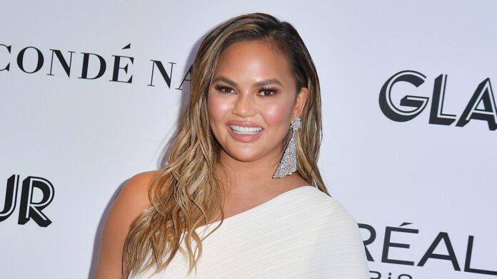 chrissy-teigen-says-she-may-undergo-second-breast-reduction-one-month-after-initial-procedure:-‘still-huge’